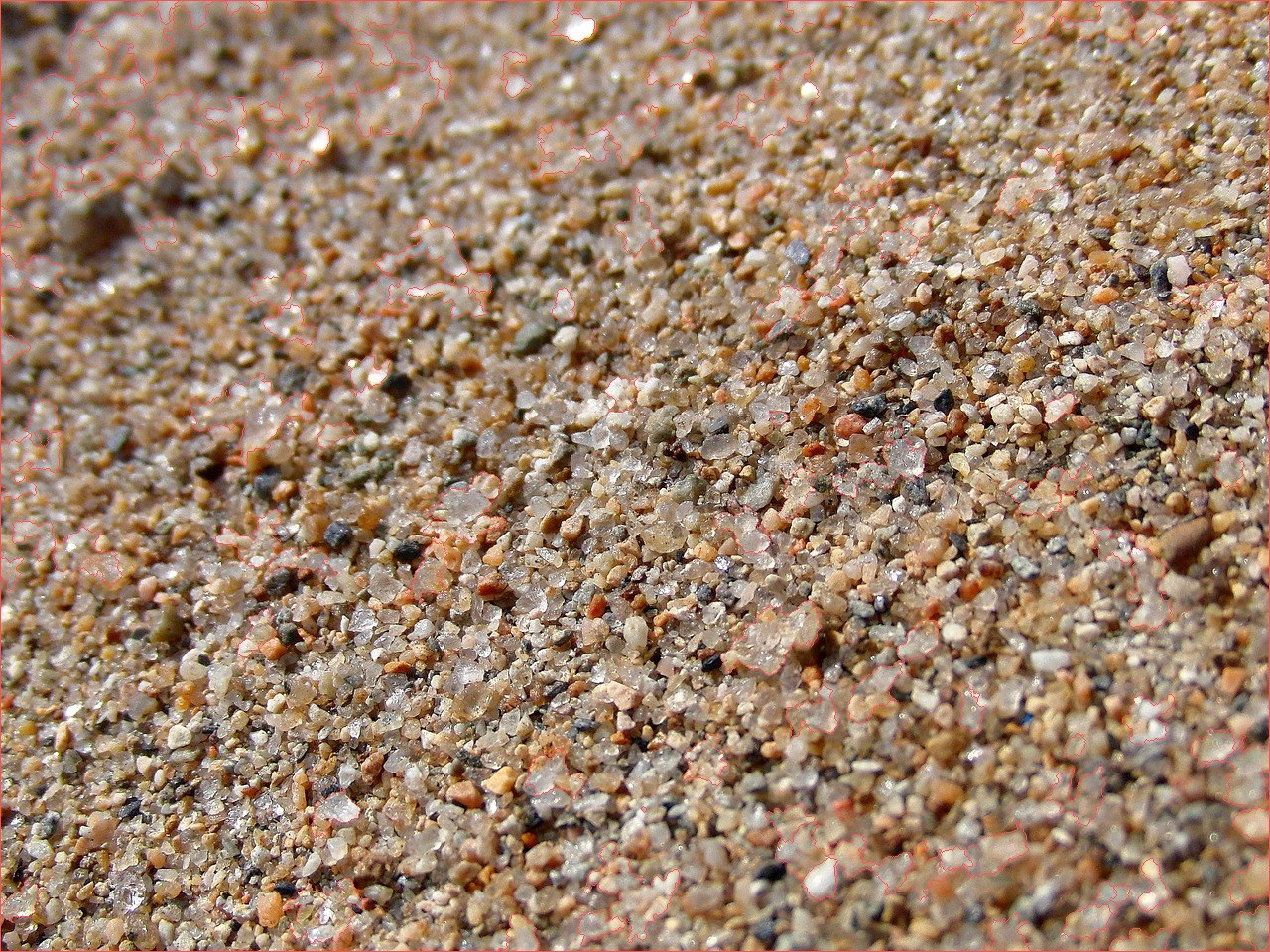 Segmentation overlay: same coarse-sand photograph with red watershed boundaries painted on, separating individual grains